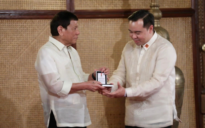 <p><strong>ORDER OF LAPU-LAPU</strong>. President Rodrigo Roa Duterte confers the Order of Lapu-Lapu with the Rank of Kamagi on Department of Tourism Undersecretary Woodrow C. Maquiling Jr. at Malacañan Palace on June 15, 2022. The Order of Lapu-Lapu is a national order of merit conferred by a Philippine President on officials and personnel of government and private individuals, in recognition of invaluable or extraordinary service in relation to a campaign or advocacy of the President. <em>(Contributed photo)</em></p>