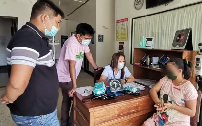 <p><strong>BRIGHT FUTURE.</strong> Pregnant New People’s Army rebel Charmaine Ravelo Coquilla (right) undergoes a medical check-up and interview after she surrendered to the Army’s 36th Infantry Battalion in Butuan City on June 14, 2022. Coquilla decided to leave the communist NPA group due to disillusionment and to provide a good future for her unborn child. <em>(Photo courtesy of 36IB)</em></p>