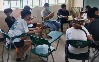 <p><strong>DIFFERENT WALKS OF LIFE.</strong> Alternative Learning System (ALS) students, from different walks of life, form a small circle inside a classroom in Cavite, in this undated photo. The ALS has been one of the education legacies fulfilled by the Duterte administration, which has been directly felt by over four million out-of-school-youth and adults since 2016. <em>(Photo courtesy: Frendy Tesorero)</em></p>