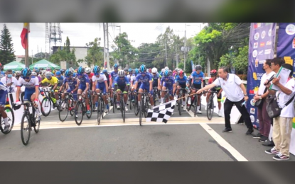 <p><strong>FLAG OFF</strong>. Philippine Olympic Committee and PhilCycling president Abraham Tolentino leads the ceremonial kickoff of the National Championships for Road in Tagaytay City in this June 2022 file photo. This year's edition will be held in and around Tagaytay City and neighboring Batangas province from May 30 to June 2. <em>(PhilCycling photo)</em></p>