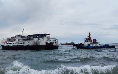 <p><strong>SEA RESCUE</strong>. The tugboat M/Tug Ankiesha tows the fast ferry M/V FastCat M6 away from the breakwaters of the Rizal Boulevard in Dumaguete City. The fast craft ran aground on Wednesday afternoon (June 22, 2022) after huge waves dislodged its anchor. <em>(Photo courtesy of PCG-Negros Oriental)</em></p>