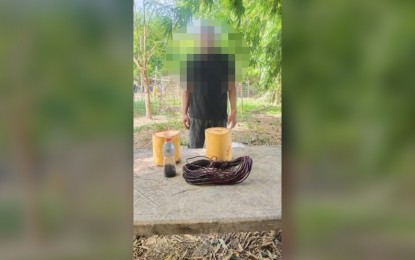 <p><strong>BOMB MAKER NO MORE</strong>. A bomb maker of the communist terrorist group surrenders to the military in San Jose City, Nueva Ecija on Wednesday (June 22, 2022). He also yielded two improvised explosive devices (IEDs), a 20-meter detonating cord, among others. <em>(Photo courtesy of 7ID, Philippine Army)</em></p>