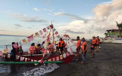 <p><strong>FLUVIAL PARADE</strong>. Philippine Coast Guard-Negros Oriental personnel supervise the boarding of motorized boats during a fluvial parade in Dumaguete City on Friday (June 24, 2022). Residents of the province celebrate the feast of St. John, the Baptist on this day each year by going to the beach, lakes, and rivers. <em>(Photo courtesy of PCG-Negros Oriental)</em></p>