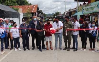 <p><strong>ROAD INAUGURATION</strong>. Negros Oriental Governor Roel Degamo (5th from left) leads the inauguration of the 18.5-kilometer Hilaitan-Trinidad road project in Guihulngan City on Thursday (June 23, 2022). The farm-to-market road is seen to spur economic development, speed up delivery of basic services, and act as a deterrent to the CPP-NPA's recruitment and other activities. <em>(Photo courtesy of the Philippine Army)</em></p>