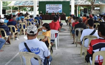 <p><strong>SETTLEMENT GRANT</strong>. Around 104 former rebels receive their settlement livelihood grant from the Department of Social Welfare and Development in a ceremony at Camp Monteclaro in Brgy. Igtuba, Miagao on Thursday. Sustainable Livelihood Program Regional Program Management Office head Mary Ann Masculino said on Friday (June 24, 2022) that they have completed their target beneficiaries this year but they will be asking for additional funds for more livelihood aid from the central office.<em> (Photo courtesy of 3rd DPAO)</em></p>