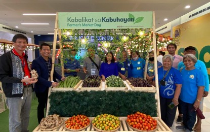 <p><strong>FARMERS’ DAY.</strong> Pangasinense farmers are all smiles as they pose in front of their booth at the SM Urdaneta Central mall. Every Friday from June 17 to December this year, farmer groups who are part of the Kabalikat sa Kabuhayan (KSK) scholarship program sell their products at the mall. <em>(Photo courtesy of KJ Santiago)</em></p>
