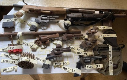 <p><strong>ARMS CACHE.</strong> Police seized a cache of firearms and ammunition Tuesday (June 28, 2022) morning during a search at a house in Barangay Sto. Niño, Tanjay City in Negros Oriental. A sexagenarian-electrician, who was the subject of the search warrant, was arrested. <em>(Photo courtesy of the Negros Oriental Provincial Police Office)</em></p>