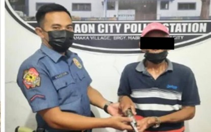 <p><strong>FIREARM SURRENDERED.</strong> A man surrenders his firearm to a police officer at the Canlaon City Police Station as part of the synchronized province-wide anti-criminal operations in Negros Oriental. More than PHP1.3-million suspected shabu was seized and over 100 people were arrested for various offenses and violations in the province. <em>(Photo courtesy of the Negros Oriental Provincial Police Office)</em></p>