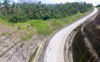 <p><strong>NEW ROAD</strong>. A portion of the completed Samar Pacific Coastal Road in Northern Samar. The opening of the Simora Bridge in Northern Samar and the 8-kilometer concrete road on Tuesday (June 28, 2022) will benefit over 5,000 poor residents in remote communities of the province, the Department of Public Works and Highways reported. <em>(Photo courtesy of DPWH)</em></p>