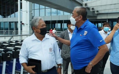 <p><strong>TRANSPORTATION CHIEFS.</strong> Transportation Secretary Jimmy Bautista (left) and former Transportation Secretary Arthur Tugade inspect the facilities of the new passenger terminal building of the Clark International Airport in Pampanga on Tuesday (June 28, 2022). Tugade called on government workers and officials under the DOTr to “give the same, if not more,” amount of support to President Ferdinand "Bongbong" Marcos Jr. <em>(Photo courtesy of DOTr)</em></p>