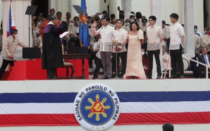 <p><strong>SWORN IN</strong>. President Ferdinand Romualdez “Bongbong” Marcos Jr. takes his oath of office as the 17th President of the Republic of the Philippines before Supreme Court Chief Justice Alexander Gesmundo at the National Museum of the Philippines in the City of Manila on Thursday (June 30, 2022). Marcos promised to promote unity and bring progress to the country. <em>(PNA photo by Avito C. Dalan)</em></p>