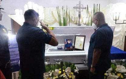 <p><strong>HERO COP.</strong> PNP officer-in-charge, Lt. Gen. Vicente Danao (right), visits the wake of Patrolman Joshua Linggayo on Tuesday (June 28, 2022). Linggayo succumbed to severe injury at the intensive care unit of a hospital on June 27, following an encounter with kidnappers in Pililla town, Rizal province on June 15. <em>(Photo courtesy of PNP)</em></p>