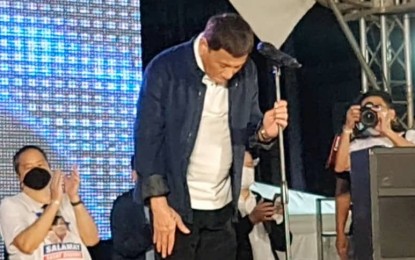 <p><strong>FINAL BOW.</strong> Former President Rodrigo Duterte takes his final bow in front of the Dabawenyos Thursday night (June 30, 2022) during a homecoming concert in Davao City. He thanked the Dabawenyos for supporting him and other members of his family who are into politics.<em> (PNA photo by Che Palicte)</em></p>