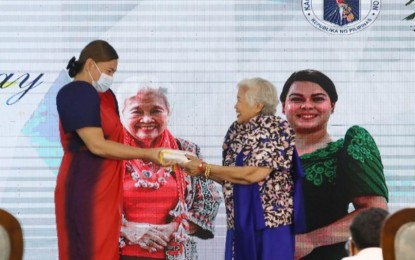 <p style="text-align: left;"><strong>SPECIAL BOND.</strong> Education Secretary, Vice President Sara Duterte, receives the flag of the Department of Education (DepEd) from her predecessor Leonor Briones in a ceremony at the DepEd Central Office in Pasig City on Monday (July 4, 2022). Duterte said she feels a "special bond" with Briones, who will act as her consultant. <em>(PNA Photo)</em></p>