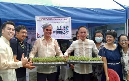 <p><strong>FOR DINAGAT FARMERS.</strong> Department of Agriculture - Caraga Executive Director Ricardo Oñate Jr. (2nd from left) leads the release of over PHP41 million support for rice and corn farmers in the Dinagat Islands province Monday (July 4, 2022). The aid, composed of farm machinery, seeds, and seedlings is received by Gov. Nilo Demerey Jr. (4th from left) and Vice Gov. Benglen Ecleo (3rd from left). <em>(Photo courtesy of DA-13 Information Office)</em></p>