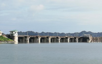 <p><strong>RIDGE TO REEF</strong>. The Magat Dam reservoir in Ramon, Isabela, shown in this 2021 photo, is supported by the forest management and preservation effort of the Cordillera Administrative Region in Ifugao province. The Cordillera Regional Development Council Committee on Watershed and Environmental Management on Wednesday (July 7, 2022) expressed hope that a law will be passed adopting the concept of a "ridge to reef" approach, where provinces that reap the benefits of the forest conservation effort at the upland areas like Cordillera will also help fund efforts to protect forests in the north. <em>(PNA file photo by Liza T. Agoot)</em></p>