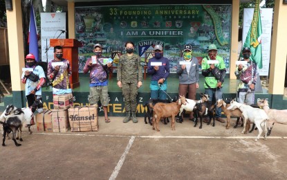 <p><strong>LIVELIHOOD AID</strong>. Eight former Communist Party of the Philippines-New People's Army (CPP-NPA) members in Central Negros receive livelihood kits from the government through the Department of Trade and Industry. The distribution of the livelihood assistance under the DTI's Pangkabuhayan sa Pagbangon at Ginhawa was held on Tuesday (July 5, 2022) at Camp Tirambulo in Guihulngan City, Negros Oriental; and in Isabela town, Negros Occidental. <em>(Photo courtesy of the 62IB, Philippine Army)</em></p>