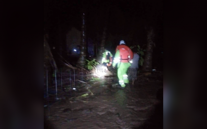 <p><strong>FLOODING.</strong> Rescuers from Mati City Disaster Risk Reduction Office conduct rescue operations Thursday night (July 7, 2022) in Barangays Central and Mayo after it was hit by floodwaters. Fifty families were evacuated and brought to safer grounds. <em>(Photo courtesy of Mati CIO)</em></p>