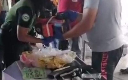 <p><strong>DRUG SHIPMENT</strong>. Government agents seize a shipment of some PHP442,000 worth of suspected shabu Tuesday (July 5, 2022) at the Zamboanga International Airport. The illegal drugs were concealed in a rubber tube and attached to a toy truck that was shipped through a courier firm to Palawan from Zamboanga City. <em>(Philippine Drug Enforcement Agency-9 photo)</em></p>