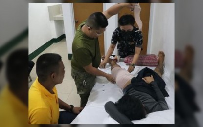 <p><strong>WOUNDED.</strong> Military physicians attend to a New People's Army rebel, one of two who surrendered in Zamboanga del Sur on Friday (July 8, 2022). The rebels were injured during a clash with government forces in Barangay Saad, Dumingag town on July 4. <em>(Photo courtesy of Army 53IB)</em></p>