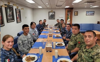 <p><strong>LIGHT MOMENT.</strong> Members of the contingents of the Philippine Navy and Mexican Navy pose for a photo opportunity during a cross-decking activity aboard the Mexican Navy's missile frigate ARM Juarez on July 7, 2022. The activity held on the sidelines of the ongoing RIMPAC 2022 in Hawaii enabled the Philippine contingent to showcase a taste of Filipino cuisine to its foreign counterparts. <em>(Photo courtesy of Philippine Navy)</em></p>