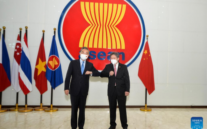<p>Chinese State Councilor and Foreign Minister Wang Yi (L) meets with Asean Secretary-General Lim Jock Hoi at the Asean Secretariat in Jakarta, Indonesia, on July 11, 2022. <em>(Xinhua/Veri Sanovri)</em></p>
