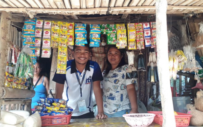 <p><strong>LIVELIHOOD AID.</strong> A representative from the Department of Trade and Industry (DTI) in Negros Oriental hands over a livelihood package to a beneficiary of the Comprehensive Social Benefits Program of the government in this undated photo. The CBSP is a program that aims to provide assistance to families of military troops and police personnel who are either killed or wounded in the line of duty. <em>(Photo courtesy of DTI-Negros Oriental)</em></p>