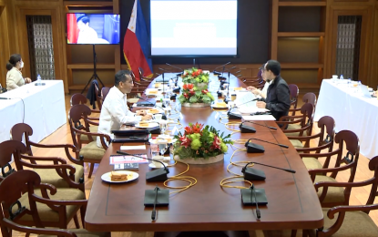 <p><strong>VIRTUAL MEETING WITH NEDA.</strong> President Ferdinand “Bongbong” Marcos Jr. meets with Socioeconomic Planning Secretary Arsenio Balisacan via teleconferencing on Wednesday (July 13, 2022). Marcos is in isolation after testing positive for Covid-19 on July 8. <em>(Screengrab from RTVM)</em></p>