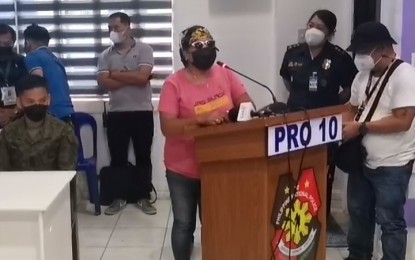 <p><strong>NEW CHAPTER.</strong> A former rebel shares the reasons for her and her 13 comrades' surrender inside the Police Regional Office-Northern Mindanao headquarters in Cagayan de Oro City on Friday (July 15, 2022). One of the reasons cited was a secure future for their families. <em>(Photo courtesy of PRO-10)</em></p>