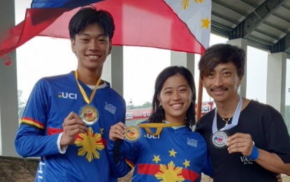 <p><strong>BMX FREESTYLE.</strong> Armand Mariano (right) and his son, Guetler, and daughter, Asianity, rule the PhiCycling National Championships for BMX Freestyle at the Tagaytay City BMX Track on Sunday (July 17, 2022). Guetler and Armand wound up 1-2 in the men’s competition while Asianity won the women’s contest. <em>(Photo courtesy of PhyCycling)</em></p>