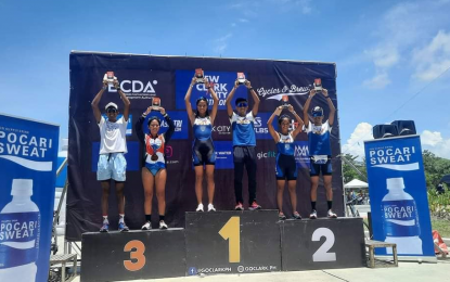 <p><br /><strong>TOP FINISHERS.</strong> Merry Joy Trupa and Raymund Torio lead the top finishers in the elite categories of the New Clark City Duathlon Race in Capas, Tarlac on Sunday (July 17, 2022). More than 650 duathletes competed in the race. <em>(Photo courtesy of GoClark Sports and Events)</em></p>