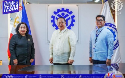 <p><strong>NEW TESDA CHIEF</strong>. New Technical Education and Skills Development Authority (TESDA) Director General Danilo Cruz (center) is welcomed by TESDA Deputy Director General for Policies and Planning Rosanna Urdaneta (left) and Deputy Director General for TESD Operations Aniceto "John" Bertiz III at the agency's central office in Bicutan, Taguig City on Wednesday (July 20,2022). Cruz was a former Labor official. <em>(Photo grabbed from TESDA's Facebook page)</em></p>