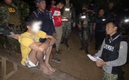 <p><strong>ARRESTED</strong>. Police arrest 29-year-old Joel C. Leyble, the most wanted person in Western Visayas following a combined operation by police and military authorities in the mountainous area of Sitio Antolihawan, Barangay Toyungan in Calinog town, Iloilo province on Wednesday (July 20, 2022). Leyble is charged with three counts of rape and one count of attempted murder. <em>(Photo courtesy of Calinog Municipal Police Station)</em></p>