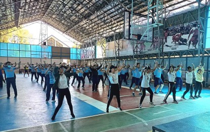 <p><strong>ZUMBA-FOR-A-CAUSE</strong>. Policemen assigned at the Police Regional Office-Cordillera participate in a Zumba class as part of a fund-raising activity of the Youth Mobile Group last July 19, 2022 at the police headquarter's gymnasium in La Trinidad, Benguet. The money raised during the event, along with donated clothes and construction materials, was sent to victims of the recent flash flood in Ifugao province. <em>(PNA photo courtesy of PROCor PIO)</em></p>