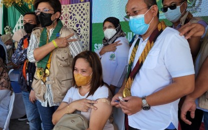 <p><strong>VACCINATION.</strong> Department of Health officer-in-charge Maria Rosario Vergeire, together with the officials of the Bangsamoro Autonomous Region in Muslim Mindanao (BARMM), lead the vaccination of adults and children against Covid-19 during the Special Vaccination Day on Thursday (July 21, 2022) in Cotabato City. The region has vaccinated 51.05 percent of its target population against Covid-19. <em>(Photo courtesy of DOH) </em></p>