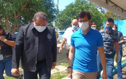 <p><strong>INVESTIGATION SOUGHT</strong>. Department of the Interior and Local Government Secretary Benjamin Abalos Jr. (right) and National Bureau of Investigation (NBI) Eastern Visayas Regional Director Romy Bon Huy Lim (left) walk outside the office in Tacloban City on Friday (July 22, 2022). Abalos asked the NBI for a thorough investigation on the alleged hazing incident that sent eight trainees of the Bureau of Fire Protection to hospitals here. <em>(PNA photo by Roel Amazona)</em></p>