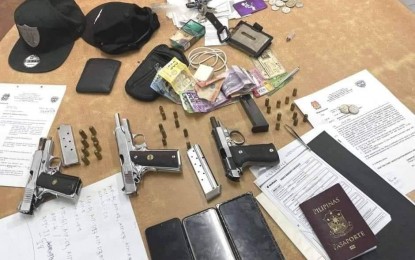 <p><strong>GUN BAN</strong>. Police recover pistols from three men arrested in Quezon City for violating the gun ban on Friday (July 22, 2022). The ban is in effect as part of security measures for the first State of the Nation Address (SONA) of President Ferdinand "Bongbong" Marcos Jr. on Monday <em>(July 25, 2022). (Photo courtesy of PNP HPG)</em></p>