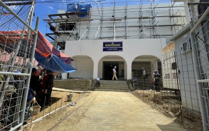 <p><strong>ONGOING CONSTRUCTION</strong>. Men are at work at the ongoing construction of the Ilocos Norte Capitol expansion building in this undated photo. Big construction projects such as this contribute to the high demand for sand in Ilocos Norte. <em>(Photo by Leilanie Adriano)</em></p>