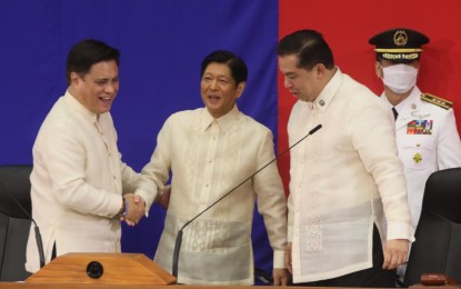 <p><strong>READY TO HELP</strong>. Senate President Juan Miguel Zubiri and House Speaker Martin Romualdez welcome President Ferdinand Marcos Jr. at the podium of the House of Representatives’ plenary hall during the President's first State of the Nation Address on Monday (July 25, 2022). Romualdez said the lower chamber fully supports Marcos' entire legislative agenda, as he vowed to act on these measures "with dispatch". <em>(PNA photo by Avito Dalan)</em></p>
<p> </p>
