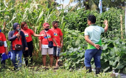 <p><strong>SUPPORT TO FARMERS.</strong> A one-hectare demonstration farm for vegetables opens Monday (July 25, 2022) in Barangay Panlaisan, Cabadbaran City. Some 250 farmers from different associations joined the opening program of the farm ,which is seen to help boost vegetable production in the city. <em>(Photo courtesy of DA-13)</em></p>