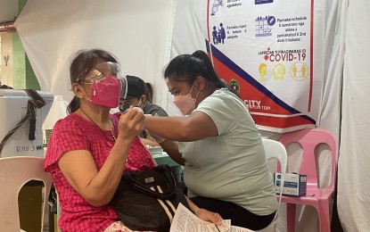 <p><strong>BOOSTER ROLLOUT.</strong> A senior citizen gets her booster shot at the Laoag City General Hospital in this undated photo. The DOH launched a nationwide PinasLakas vaccination drive on July 26, 2022 to administer booster shots to the eligible population. <em>(File photo by Leilanie Adriano)</em></p>