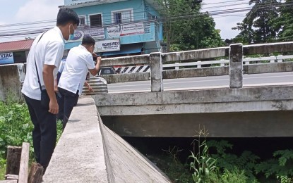 <p><strong>DAMAGE ASSESSMENT</strong>. Personnel of the Department of Public Works and Highways-Central Luzon (DPWH-3) thoroughly assess the structural integrity of a bridge in Tarlac province to determine the possible impact of the earthquake that took place on Wednesday morning (July 27, 2022). DPWH-3 Regional Director Roseller Tolentino said evaluation must be done immediately to ensure the safety of the general public. <em>(Photo courtesy of the DPWH-Region 3)</em></p>