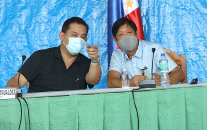 <p><strong>GOV’T RESPONSE</strong>. President Ferdinand "Bongbong" Marcos Jr. and Speaker Martin Romualdez discuss with local officials and provincial engineers updates on magnitude 7 earthquake during their visit in Abra on Thursday (July 28, 2022). They also discussed the immediate rehabilitation and restoration of affected roads, bridges, churches, residential buildings, schools and hospitals following Wednesday’s magnitude 7 earthquake.<em> (Photo courtesy the Office of House Speaker Martin Romualdez)</em></p>