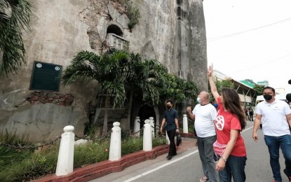 <p><strong>LAOAG SINKING TOWER</strong>. Senator Imee Marcos checks the Laoag sinking belltower for damage on Thursday (July 28, 2022), a day after a strong quake hit Luzon. Marcos said a separate fund is needed for specialists to conduct a non-destructive assessment of heritage structures. <em>(Photo courtesy of Han EJ Julian)</em></p>