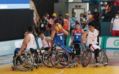<p><strong>TIGHT SPOT.</strong> Team Philippines’ Alfie Cabanog (No. 8) looks for an opening in their match against Indonesia at the start of the 11th ASEAN Para Games at GOR Sritex Arena in Surakarta, Indonesia on Saturday (July 30, 2022). The Philippines won, 15-10, and will next face Thailand at 12:30 p.m. and Cambodia at 2 p.m. on Sunday.<em> (Photo courtesy of PSC)</em></p>
<p><em> </em></p>