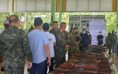 <p><strong>NO TO VIOLENCE.</strong> Government security forces receive 100 former members of the Abu Sayyaf Group during a surrender and turnover of firearms ceremony at Sulu Provincial Gymnasium in Jolo on Saturday (July 30, 2022). The government will provide financial and livelihood assistance to help them reintegrate to society. <em>(Photo courtesy of PNP)</em></p>