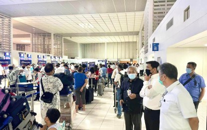 <p><strong>NAIA INSPECTION.</strong> Transportation Secretary Jaime Bautista (fourth from right) during a surprise inspection of the Ninoy Aquino International Airport (NAIA) Terminal 2 on Monday evening (Aug. 1, 2022). Following the inspection, Bautista recommended several possible improvements such as ensuring the availability of basic amenities in comfort rooms, improved lighting and airconditioning in the pre-departure area, and the availability of reliable free internet connection.<em> (Photo courtesy of DOTr)</em></p>