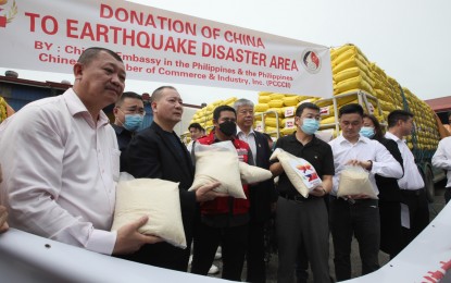 <p><strong>CHINA AID TO QUAKE VICTIMS.</strong> Department of Social Welfare and Development Assistant Secretary Romel Lopez (3rd from left) receives China's rice donation to the earthquake victims at the National Resources Operation Center in Pasay City on Tuesday (Aug. 2, 2022). China formally turned over PHP10 million worth of rice to the Philippine government as aid to the victims of the magnitude 7 earthquake that hit northern Luzon last week. <em>(PNA photo by Avito Dalan)</em></p>