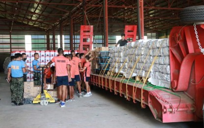 <p><strong>‘BAYANIHAN’.</strong> The personnel of the Philippine National Police and Philippine Coast Guard prepare the food and non-food items to be distributed to earthquake-stricken areas in the Ilocos Region. The relief assistance of the Department of Social Welfare and Development is an augmentation to those provided by the local government units. <em>(Photo courtesy of DSWD Ilocos regional office)</em></p>