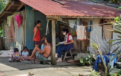 <p><strong>VALIDATION</strong>. A social worker interviews a household in Palompon, Leyte in this October 22, 2021 photo. At least 365,056 families in Eastern Visayas have been identified as poor based on the result of the Listahanan 3 survey as part of the National Household Targeting System for Poverty Reduction. <em>(Photo courtesy of Department of Social Welfare and Development)</em></p>